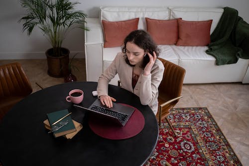 Free Overhead Shot of a Woman using Laptop Stock Photo