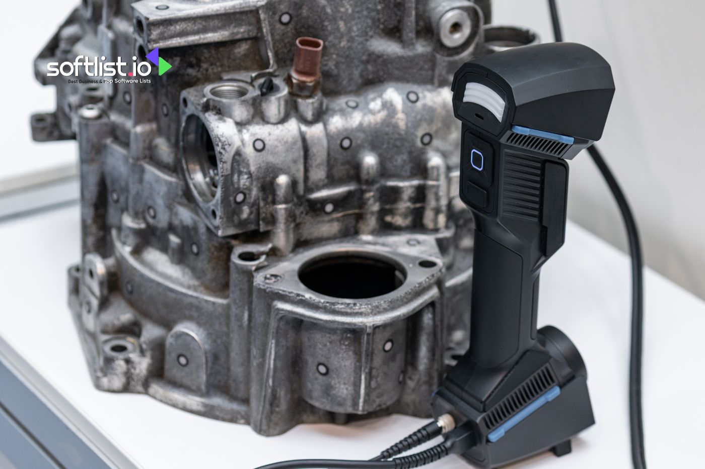 3D scanner and metal engine part on table