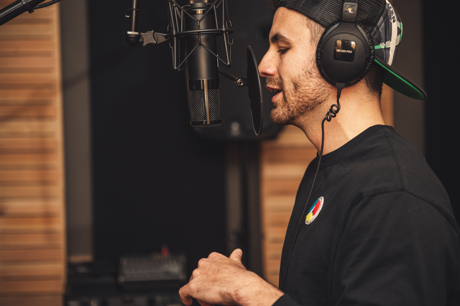 Alt text: same audio file: A man is recording his voice over the microphone