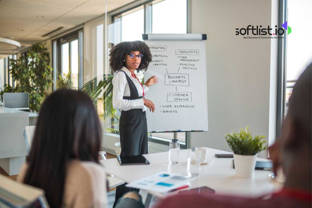 A person showing business strategy on white board