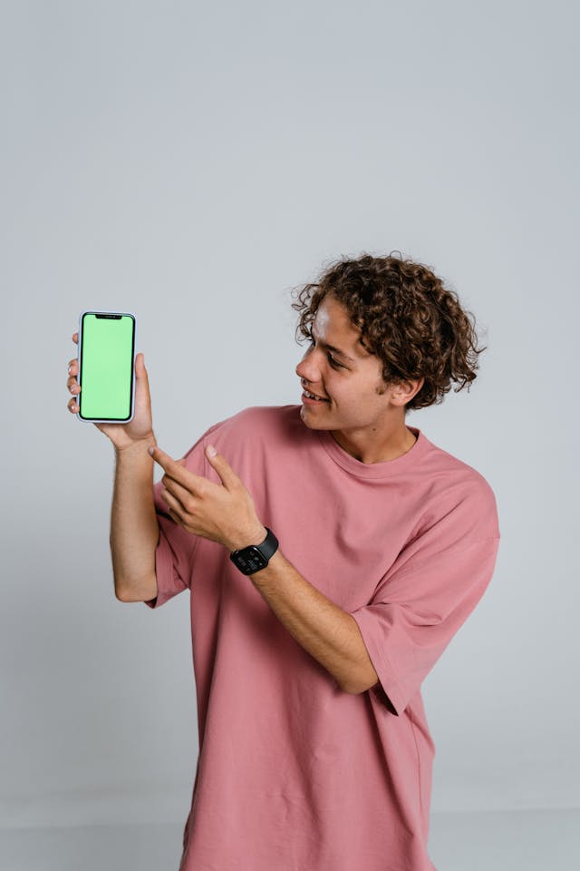 Man holding a phone for free trial