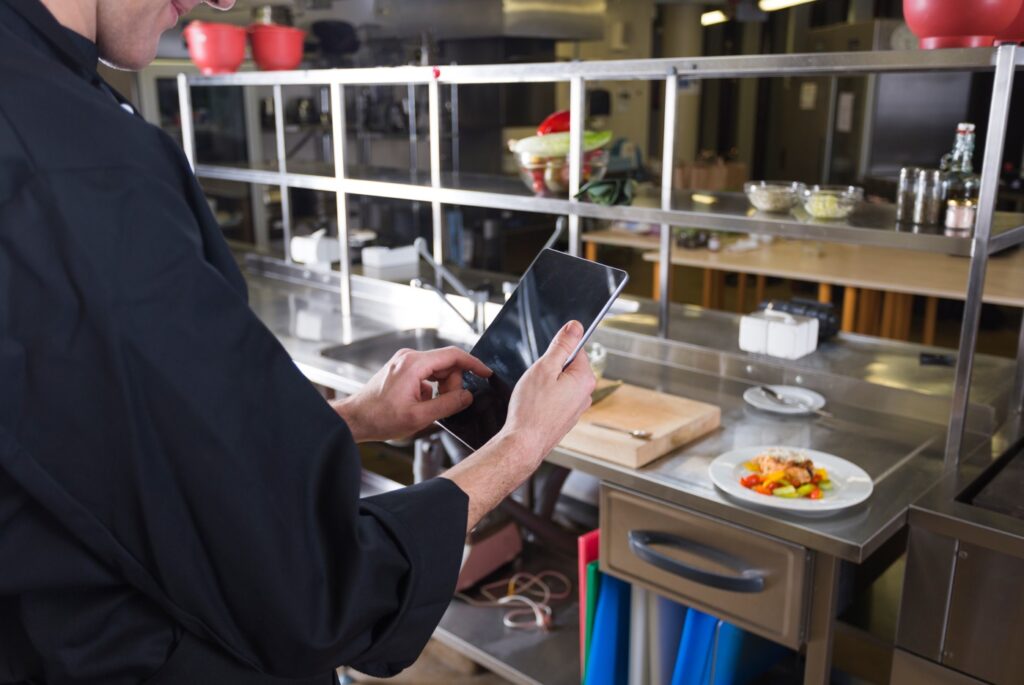 a chef taking photo of the food
