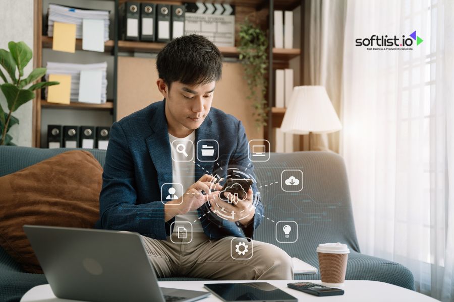 Professional working on smartphone with digital icons and Softlist.io branding