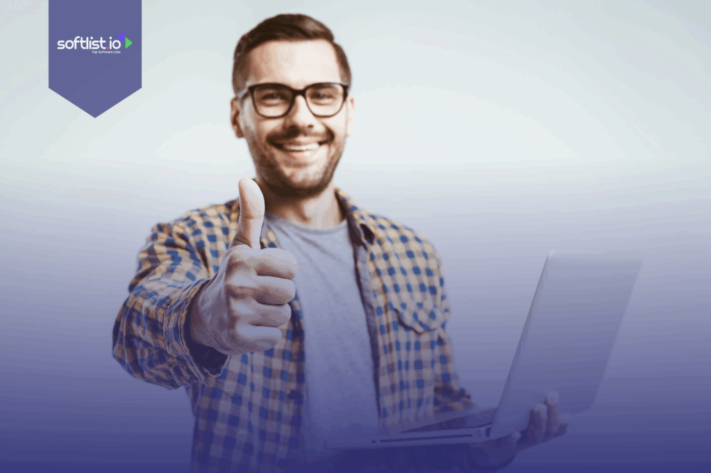 A man holding a laptop and doing thumbs up