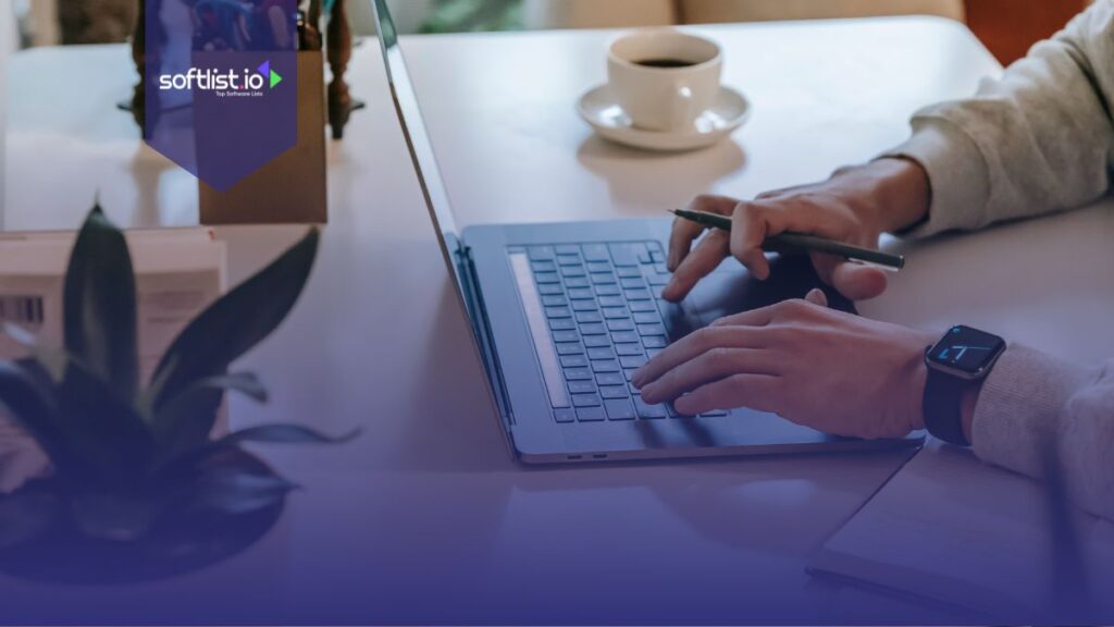 Faceless male freelancer using netbook near coffee cup and notepad.