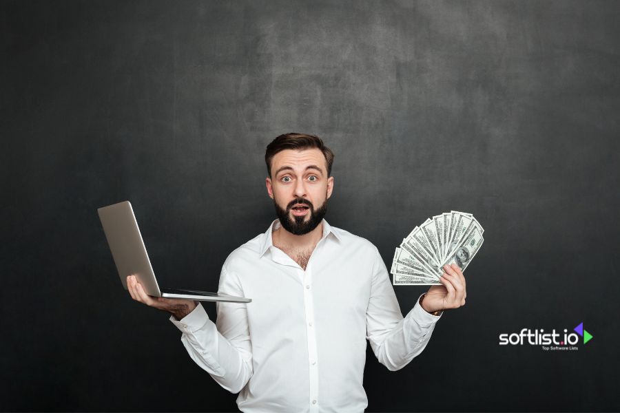A surprised man holding money, thinking that Managed IT services are expensive